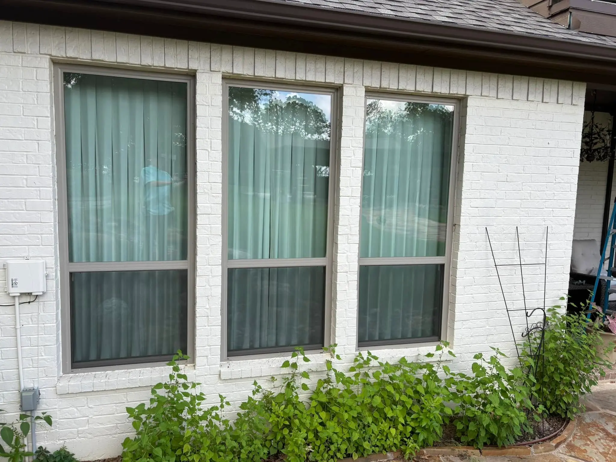 White brick home exterior windows cleaned streak-free by Rodeo Shine